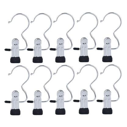 Ten metal clip holder hooks on white background