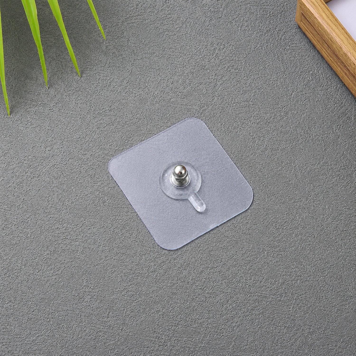 Transparent adhesive wall hook frames