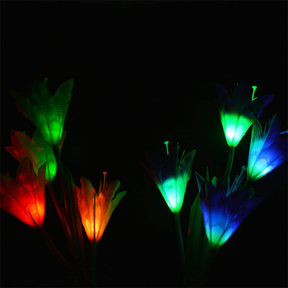 Solar flower LED lights glowing at night