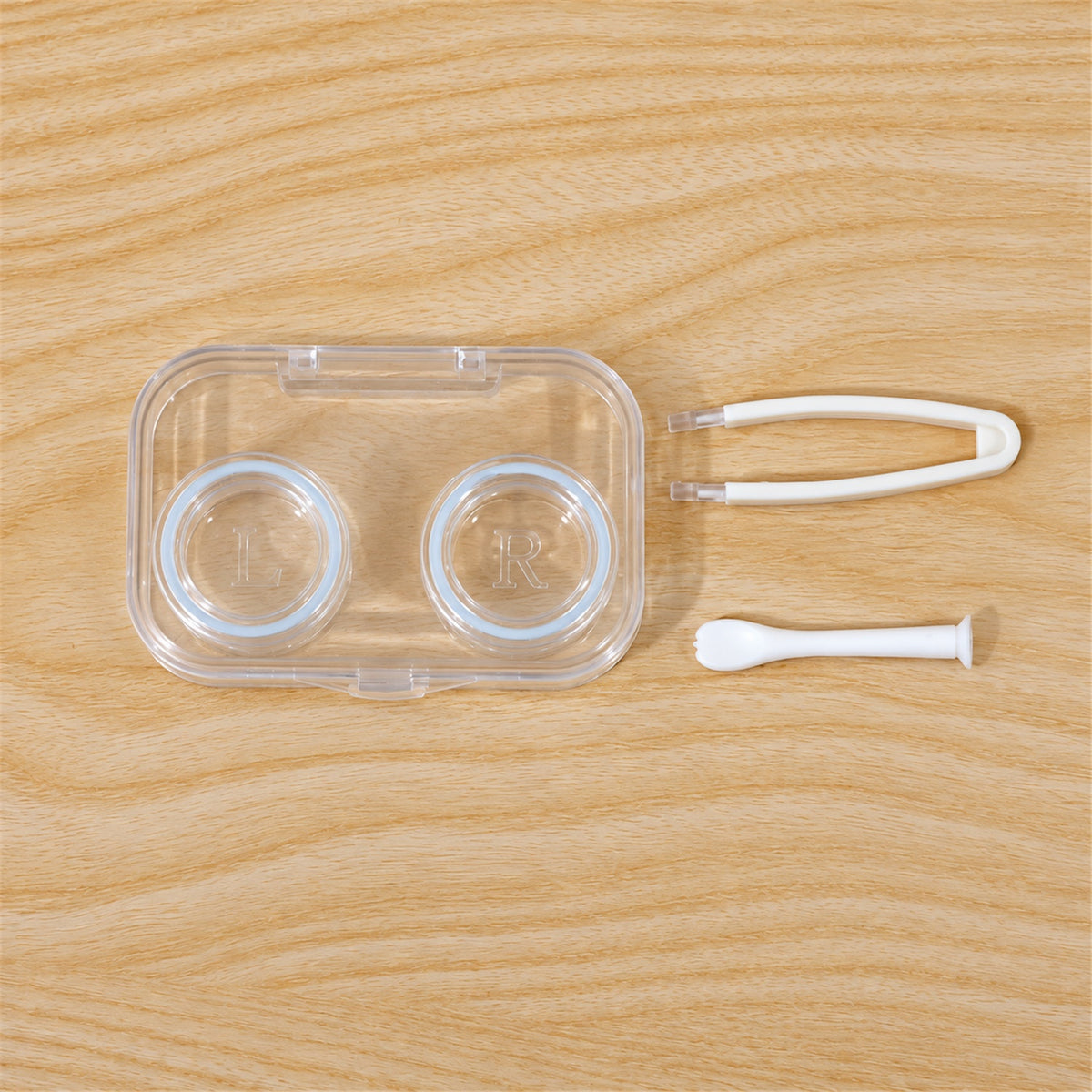 Compact contact lens case with tweezers and applicator 08