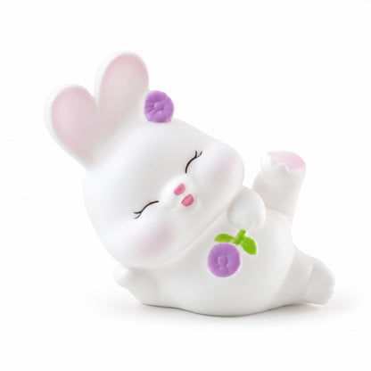 Reclining rabbit lamp on white background