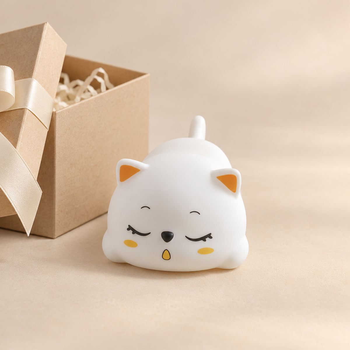 Cat lamp styled beside a gift bag
