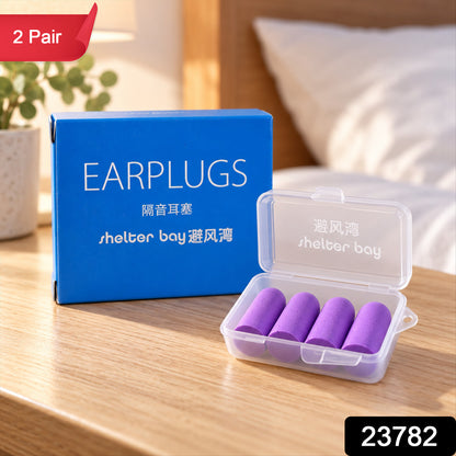 Four purple foam earplugs in a clear case next to a blue box on a wooden surface, with a red label.