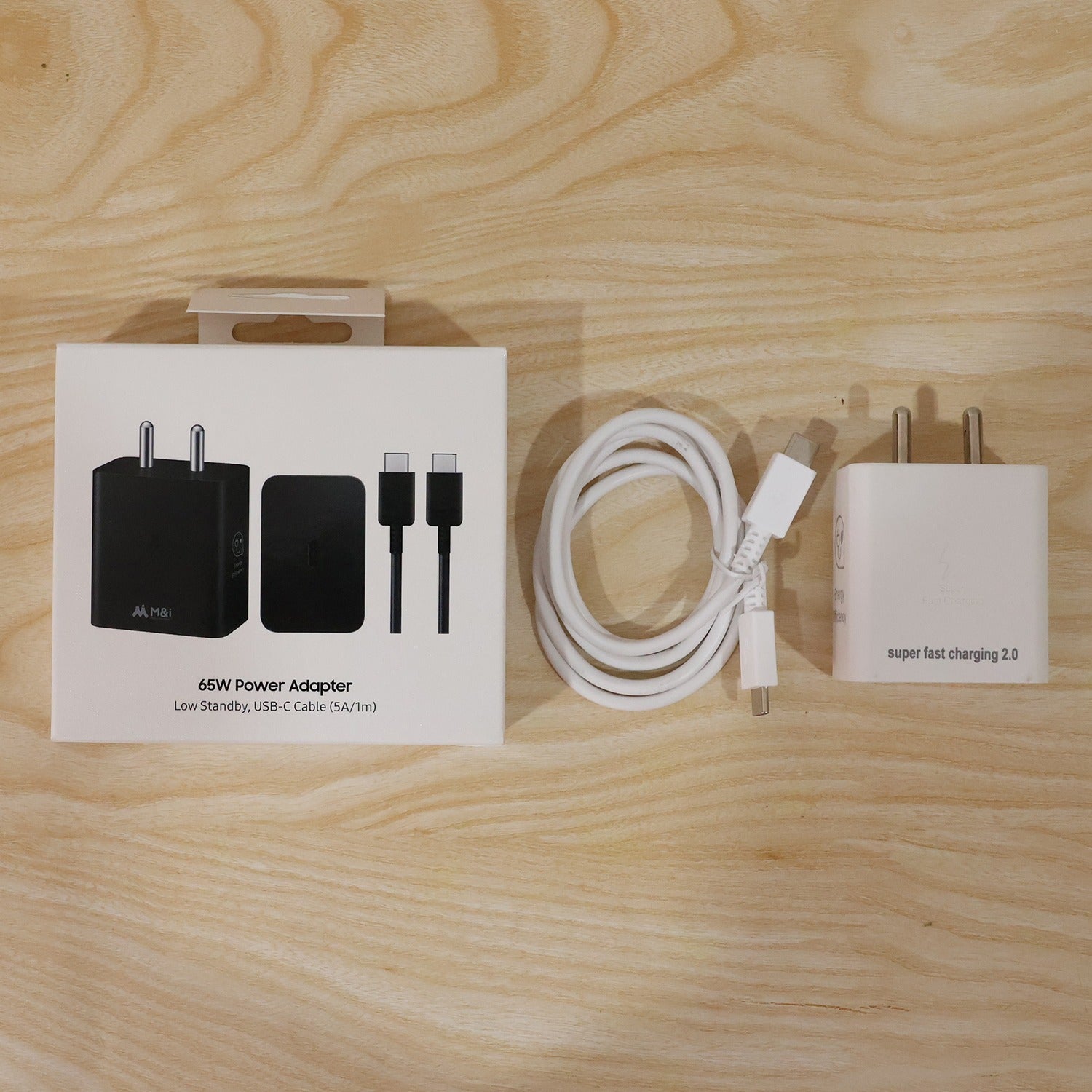 65W power adapter with Type C cable on white background