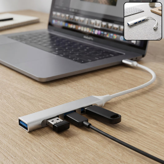 A silver Type C to four-port USB hub connected to a laptop, with a USB drive and cable plugged in