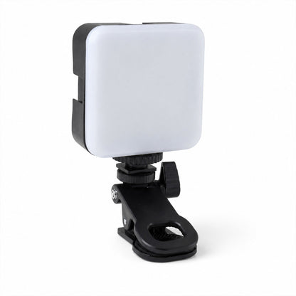 Portable LED camera light on white background