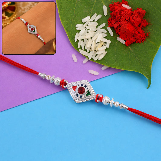 Square silver rakhi with red stone center and pearl bead chain