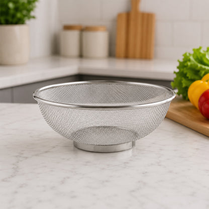 Stainless steel kitchen colander on counter