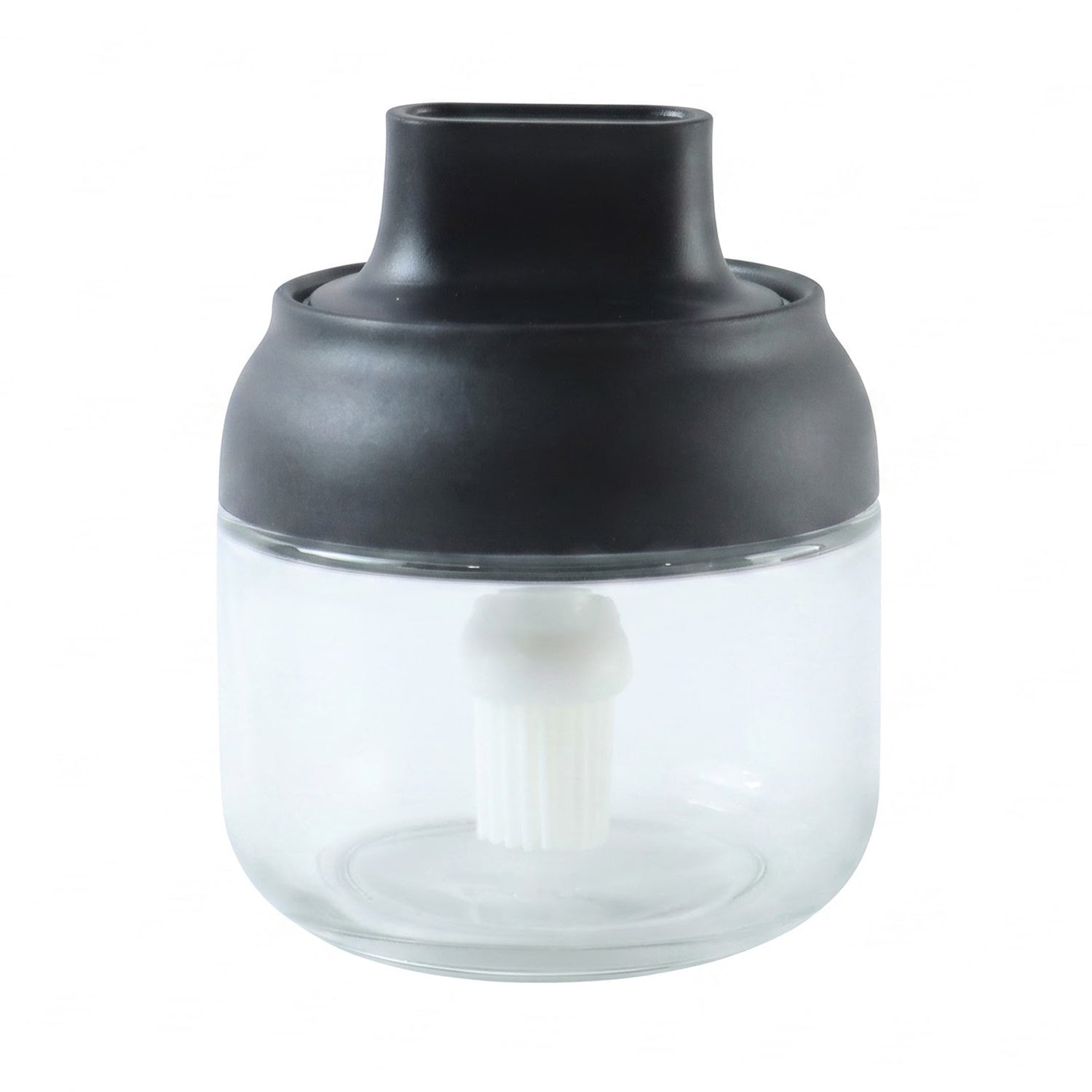 Round jar oil dispenser on white background