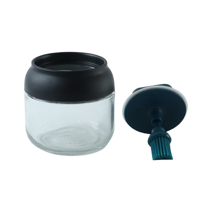 round glass oil dispenser white background