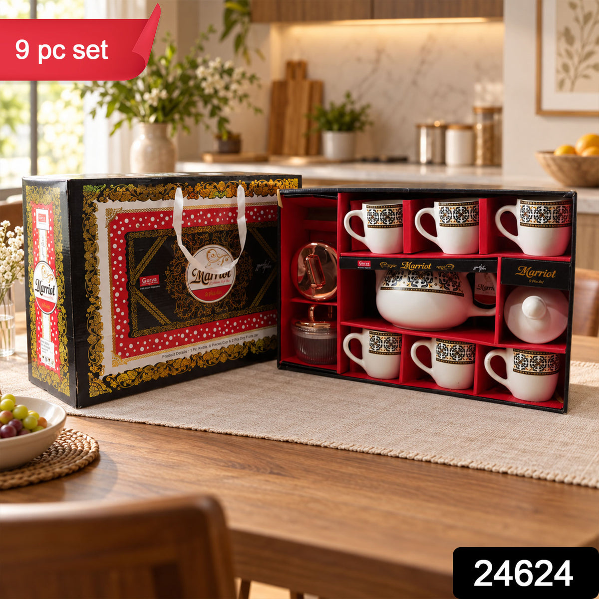 An open Marriot gift box displaying a tea set with six cups, a teapot, and two small jars, on a wooden table.