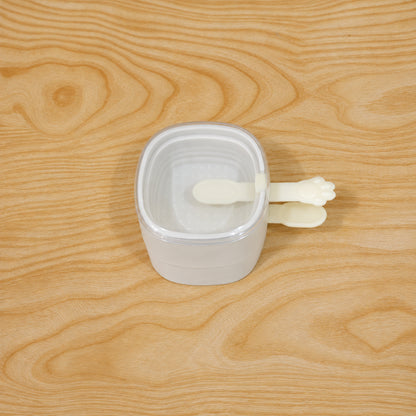 Different angles of the stackable square ice cream mould with lid and paw handles
