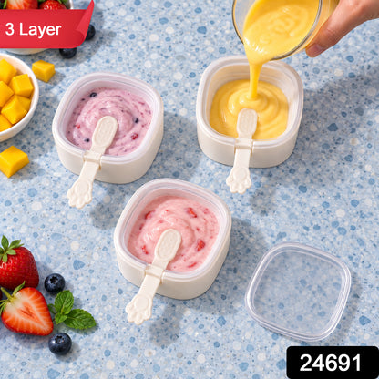 Three square molds with paw handles, filled with pink and yellow purees, one being poured. Strawberries and – view 10