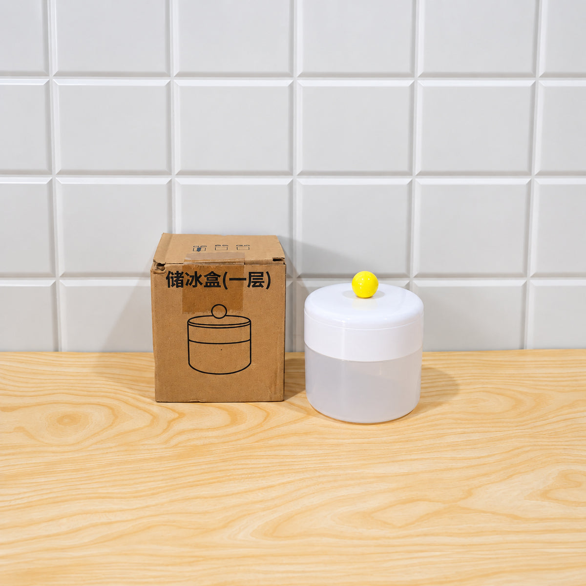 Top down view of the round ice cube maker with lid