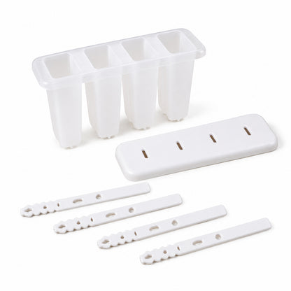 A white 4-cavity popsicle mold, its lid, and four individual white sticks are neatly arranged on a plain white surface.