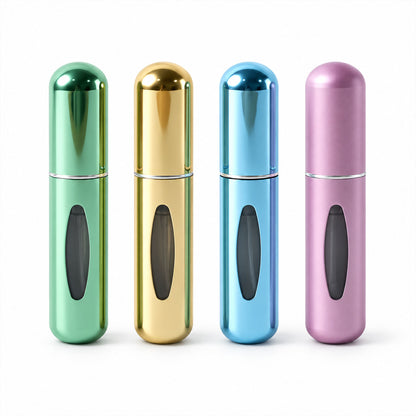 Four mini perfume bottles on white background