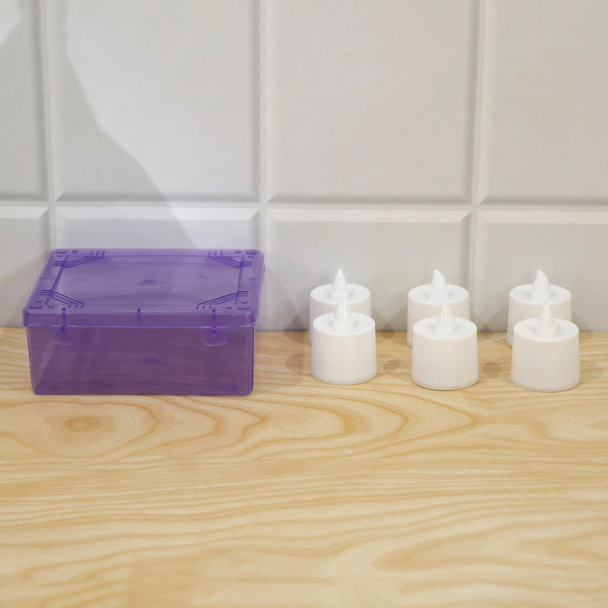 Green flameless LED tealights - actual product and plastic box