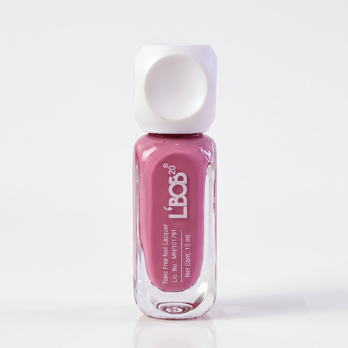 A clear glass bottle of mauve nail polish with a white square cap stands upright on a white background.