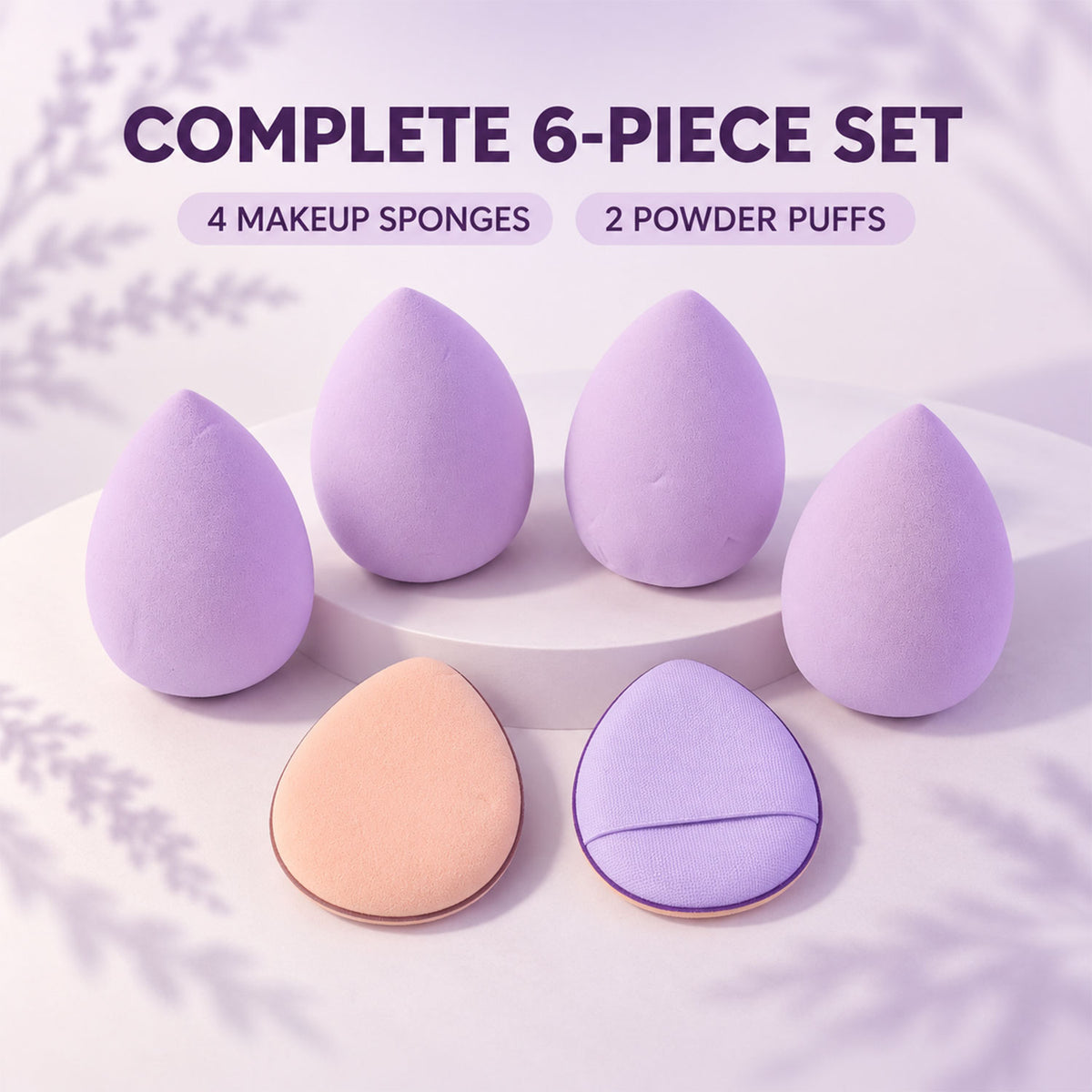 Four lavender makeup sponges and two powder puffs, one peach and one purple, are displayed on a white stand.