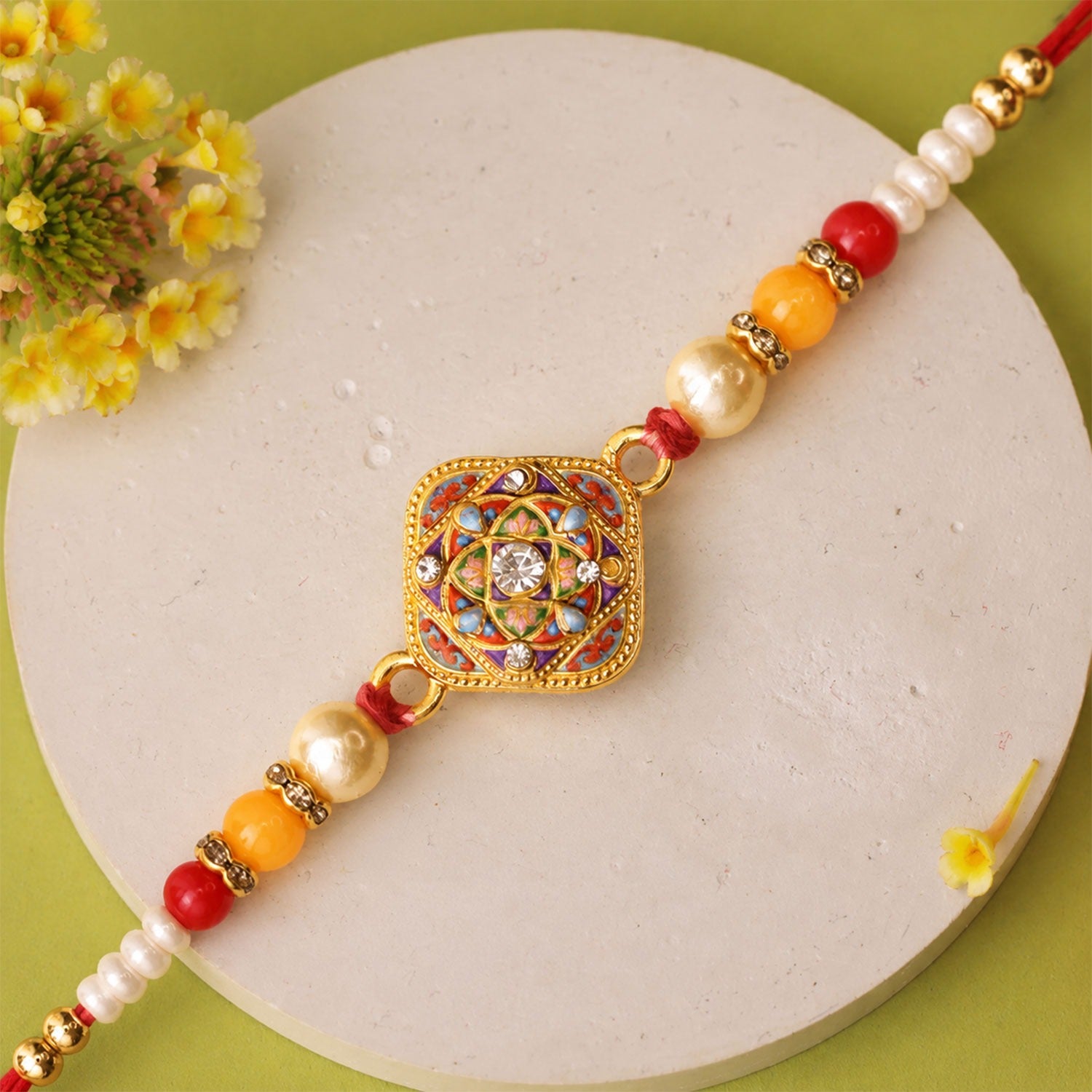 Mandala Rakhi featuring an intricate square design perfect for Raksha Bandhan celebrations.