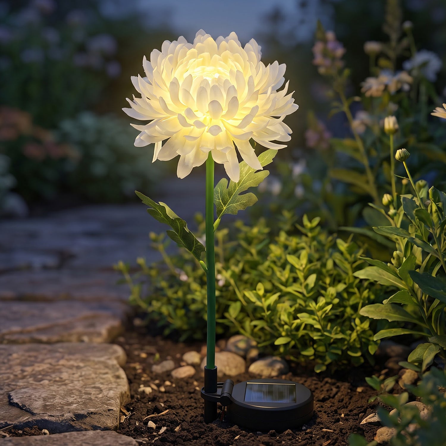 Solar flower LED stake light glowing in garden
