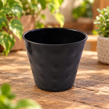 Decorative plastic flower pot detail view