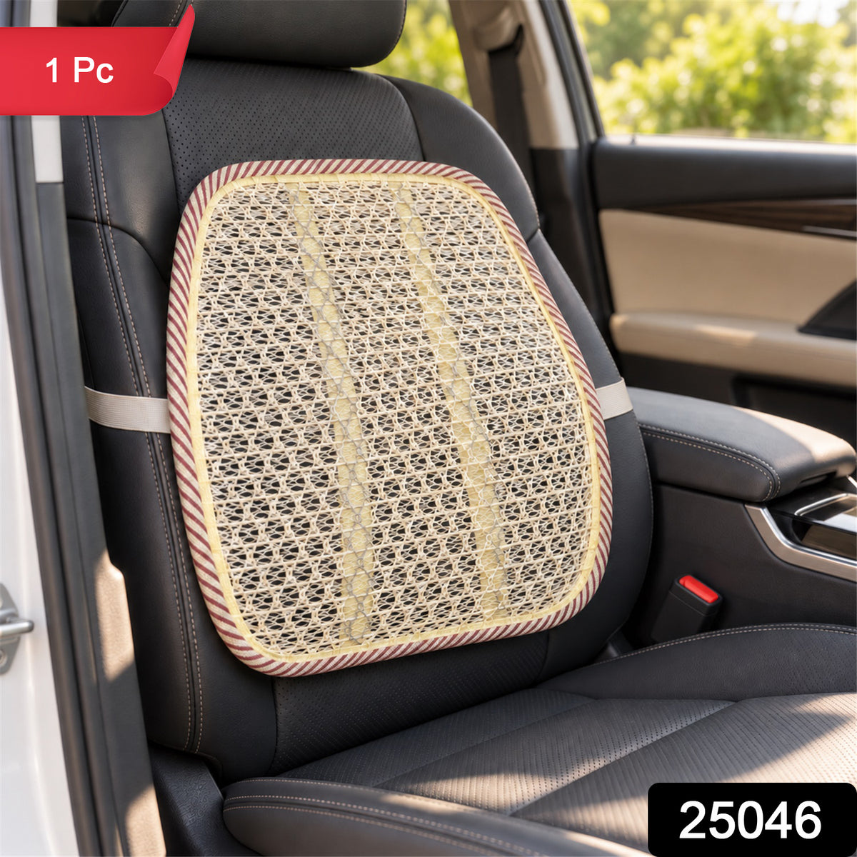 A beige mesh back support cushion with a red and white striped border is strapped to a black leather car seat.