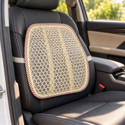 A beige mesh back support cushion with a striped border is secured to a black car seat, with sunlight filtering through