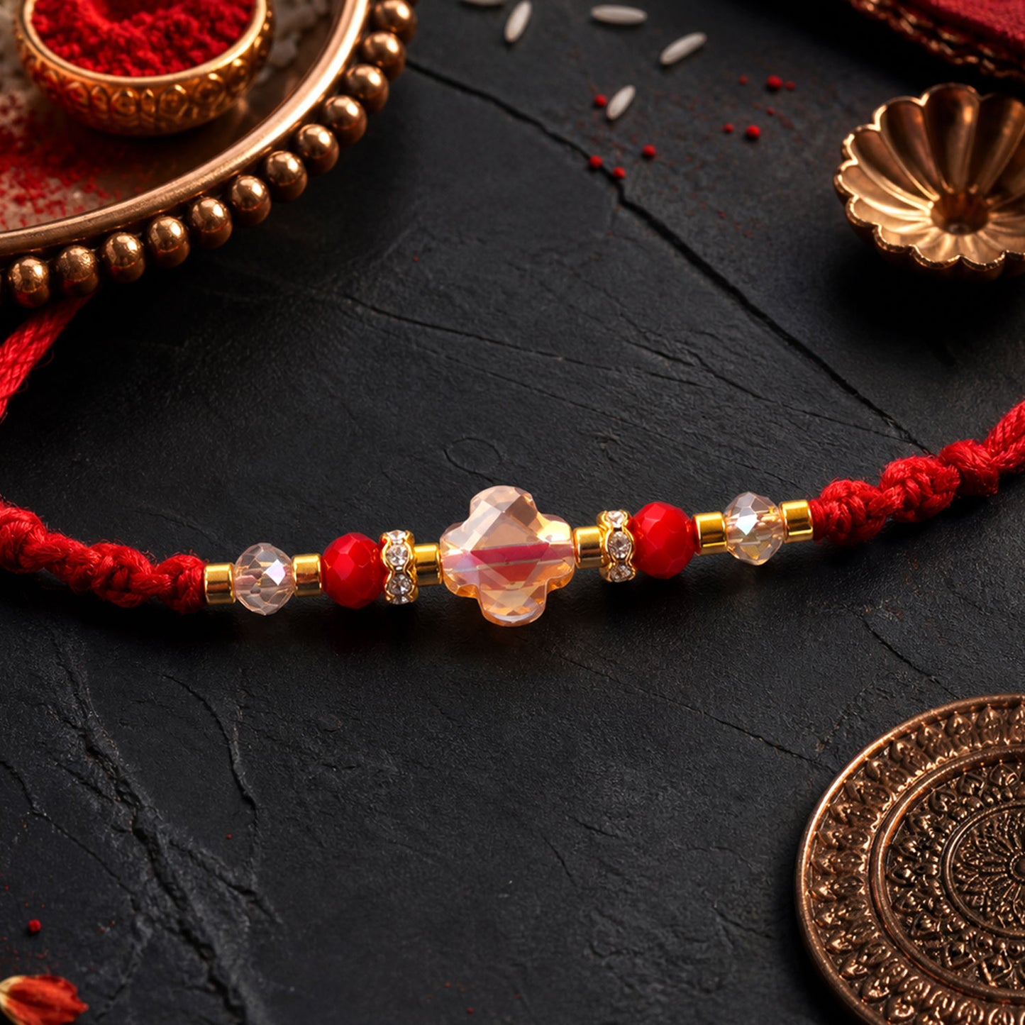 Red Thread Rakhi with a Row of Sparkling Crystal Bead Pendant Accents
