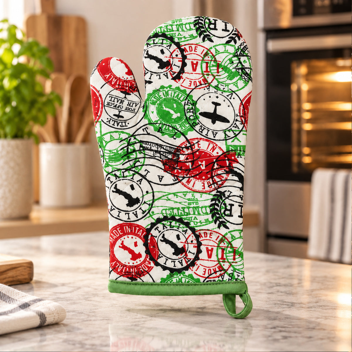 Travel stamp print quilted oven hand glove - kitchen counter display
