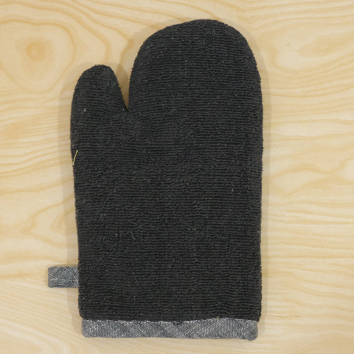 Black textured oven hand glove - actual product