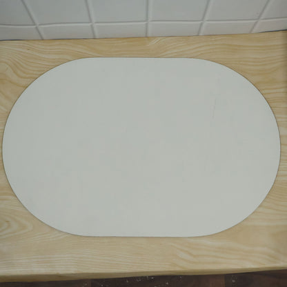 Decorative rounded floor mat with textured surface actual product