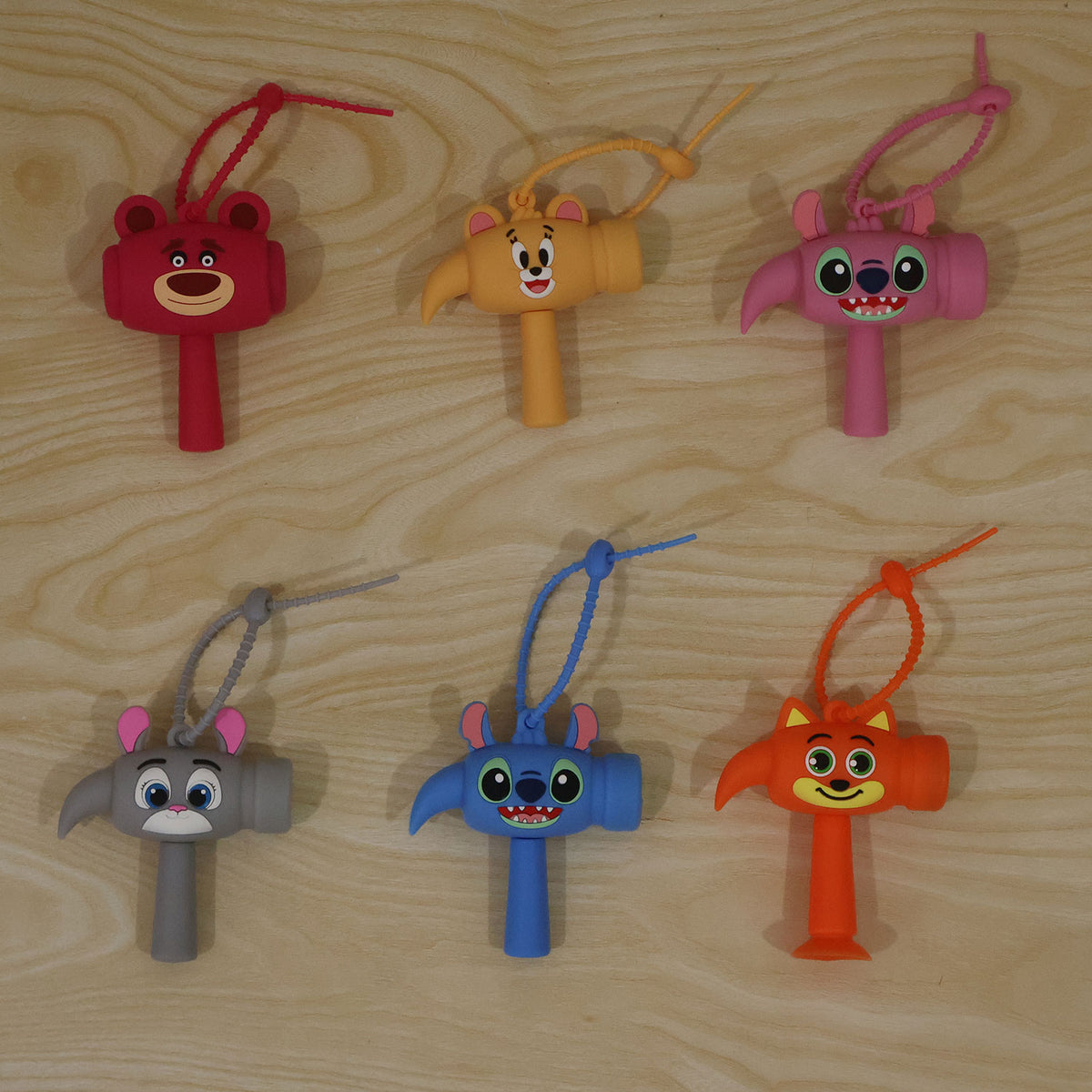 Cartoon sound hammer keychain toy in assorted designs, actual product photo
