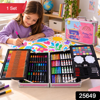 A girl draws on paper with a marker, beside an open art kit containing various drawing and painting tools.