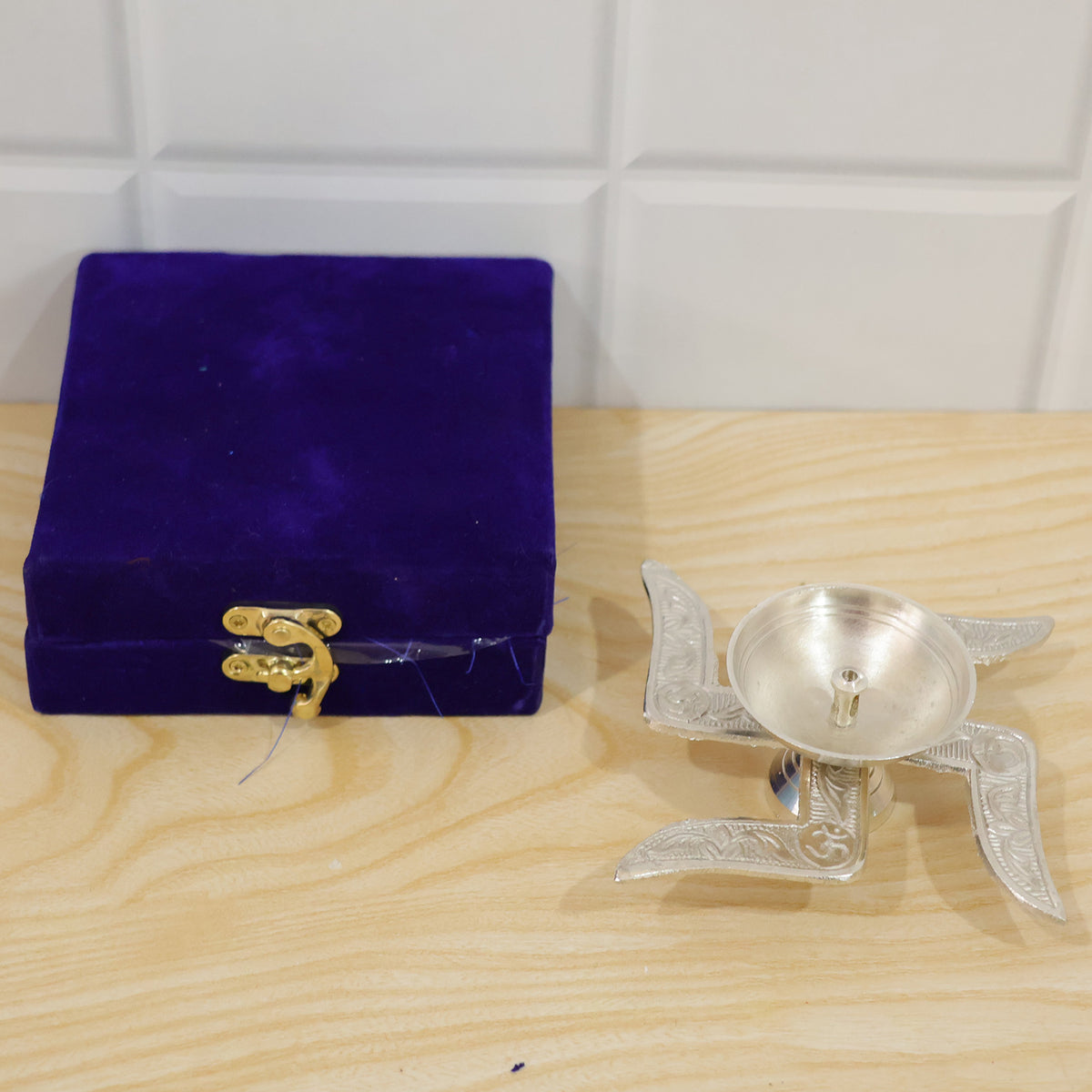 Silver finish traditional Swastik design diya with velvet box actual product