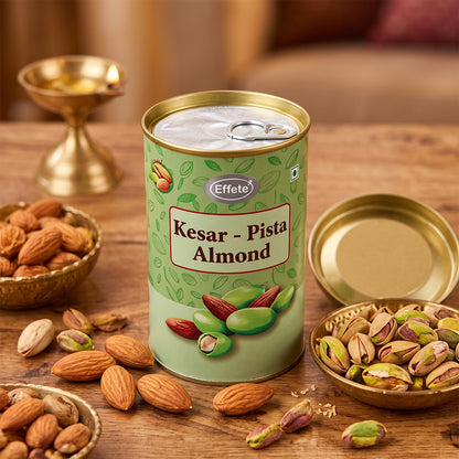 A tin of Kesar-Pista Almonds is surrounded by loose almonds and pistachios on a wooden surface.