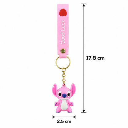 A pink silicone keychain with a cartoon alien charm is shown with precise measurements for its length and width on a white