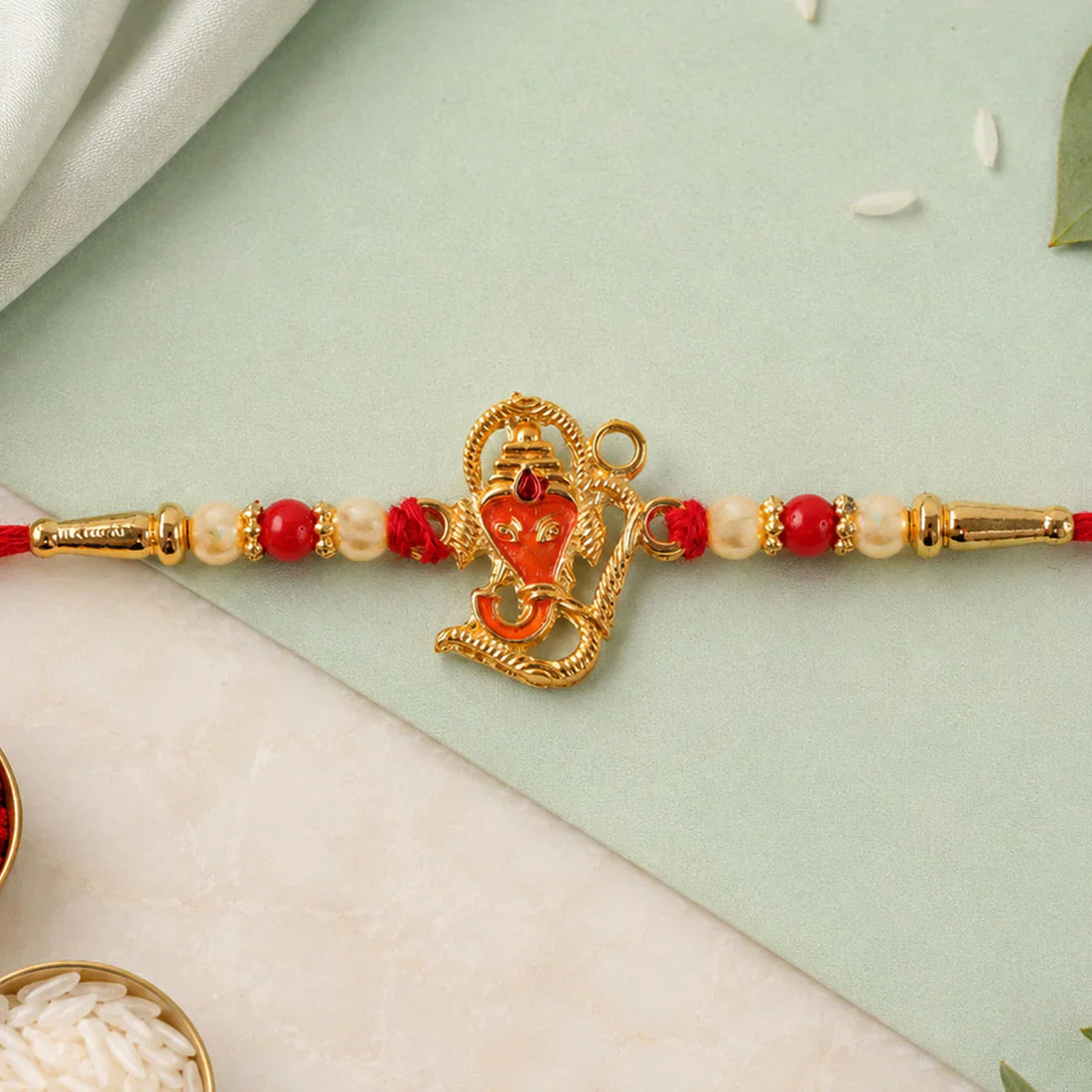 Shree Ganesh Rakhi featuring an intricate Ganesh motif for Raksha Bandhan.