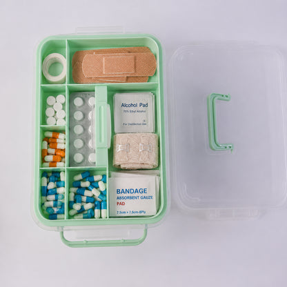 First aid box with compartments for medical supplies