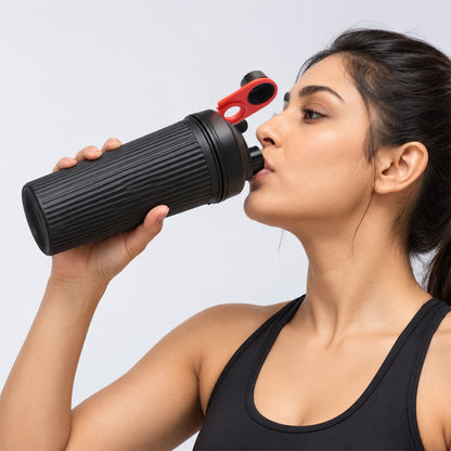 Gym shaker bottle with mixing ball - drinking spout in use