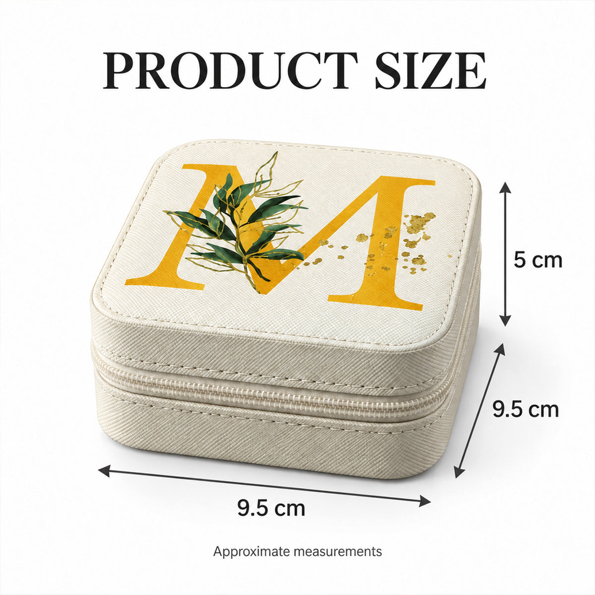 A beige jewellery box with a gold 'M' on top, displaying its dimensions: 9.5 cm wide, 9.5 cm long, and 5 cm high.