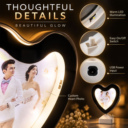 Close-up of the heart-shaped LED mirror photo frame showing details like the USB port and power switch.