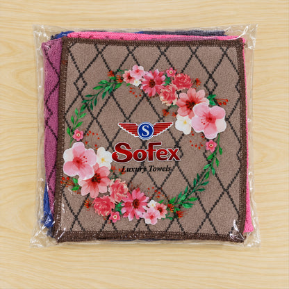 A clear plastic package containing multiple colored handkerchiefs with a diamond pattern, featuring a floral Sofex brand
