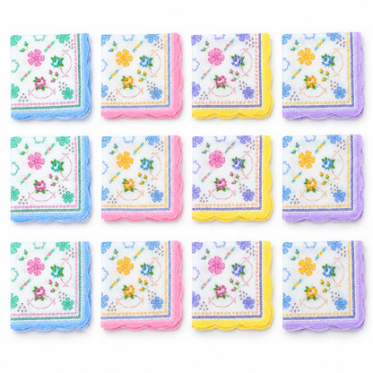 Twelve folded cotton handkerchiefs with diverse floral patterns and scalloped borders in blue, pink, yellow, and purple are