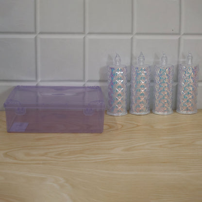 Four unlit crystal LED candles and a closed purple storage box are arranged on a light wooden surface against a white tiled