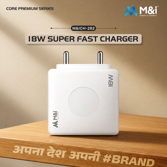 A white 18W super fast charger with two metal prongs stands on a light brown wooden surface.