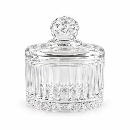 Empty clear glass candy bowl with a decorative faceted lid, showcasing its vertical ribbed design and patterned base.