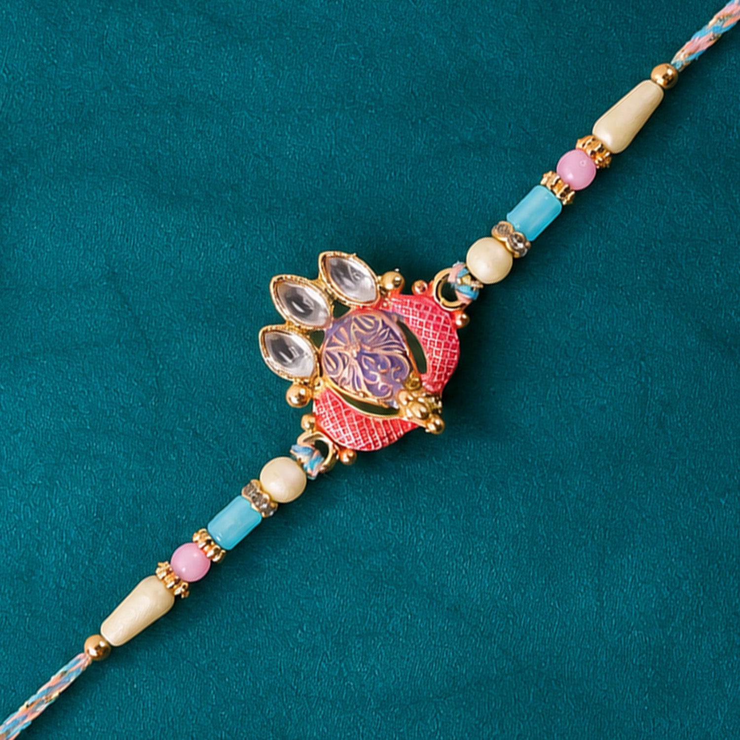 Coral Enamel Medallion Pendant Rakhi with Kundan Teardrop Stones