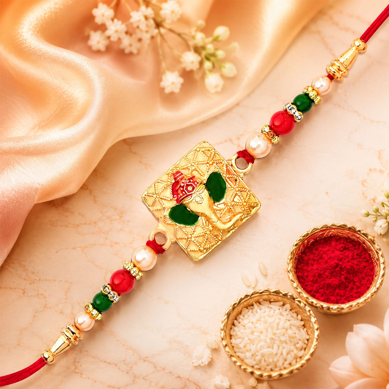 Golden Ganpati Rakhi displayed in a festive setting for Raksha Bandhan.
