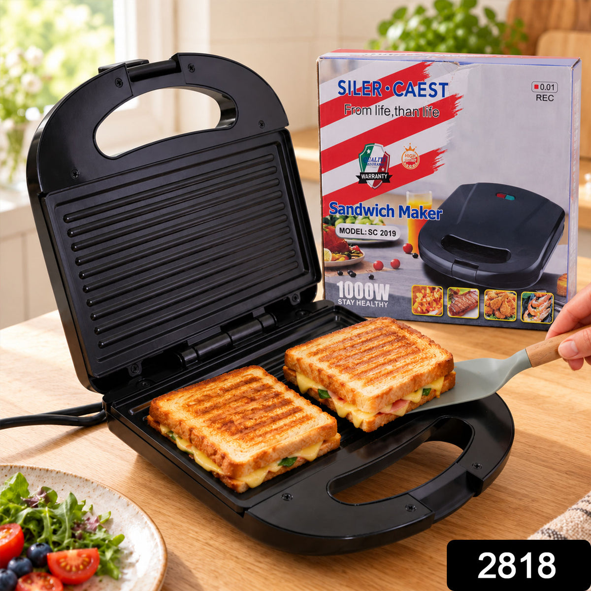A black sandwich maker with dual indicator lights, showing its non-stick plates, easy-grip handle, and power plug details.